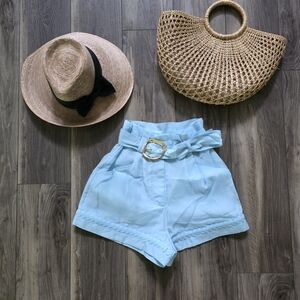Aje High Waist Paperbag Shorts in Light Blue with Gold Buckle